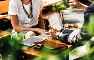 Two people discussing how to assess candidates before interviewing