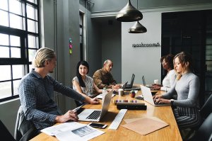 People in a business meeting talking about startup hiring