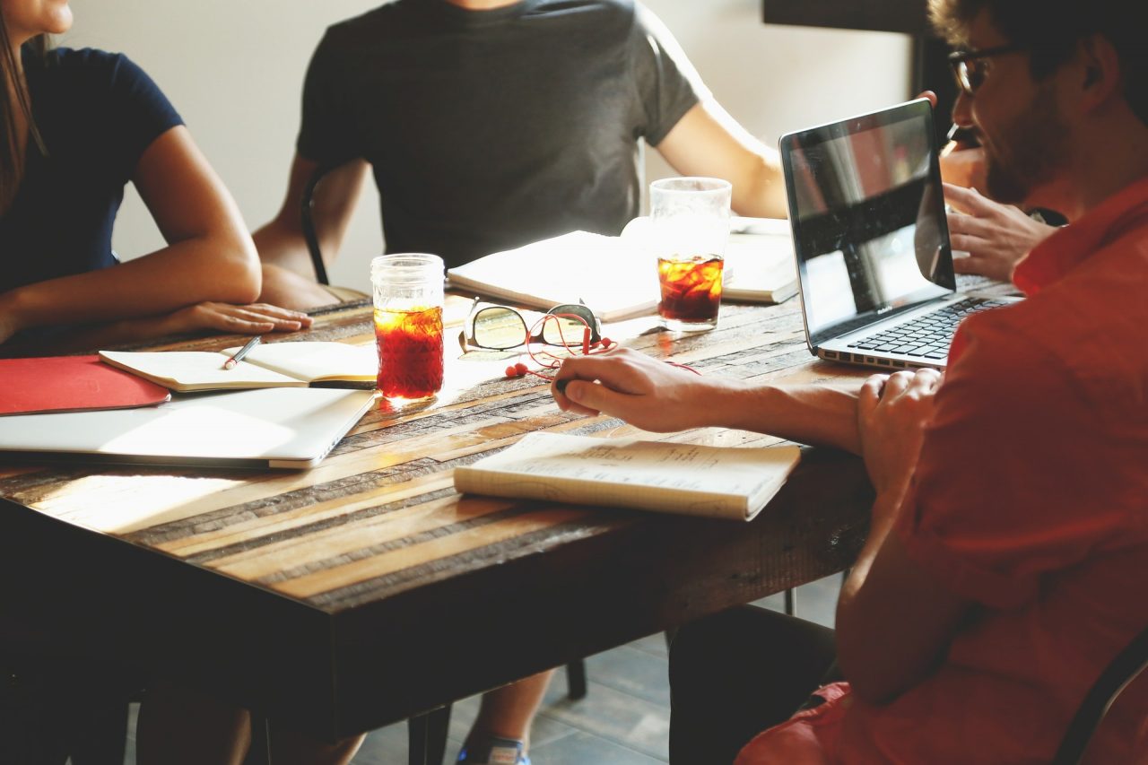 People in a business meeting discussing team-building tips for company culture