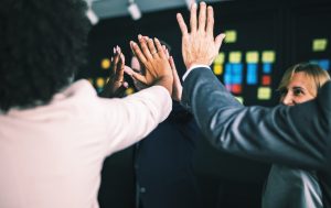 People high-fiving