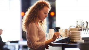 A woman working at a restaurant
