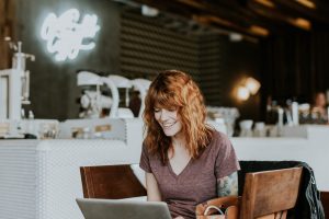 A woman on a laptop, recruiting to build a strong team