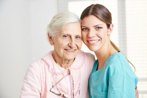 A young caregiver and an older woman