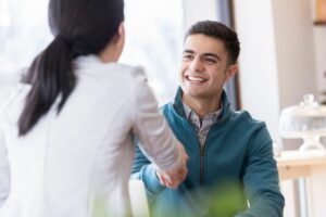 A man and woman shaking hands