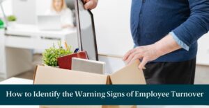 Someone packing up their desk with text reading "How to Identify the Warning Signs of Employee Turnover"