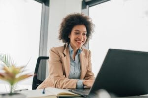 A woman on a laptop creating an applicant persona