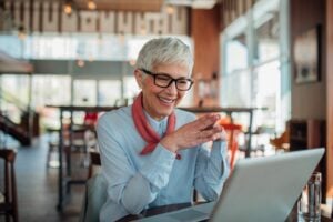 A woman on a laptop hiring applicants