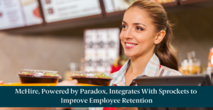 A fast food cashier with text reading, "McHire, Powered by Paradox, Integrates With Sprockets to Improve Employee Retention"