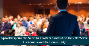 A business conference and text reading, "Sprockets Joins the National Owners Association to Better Serve Customers and the Community"
